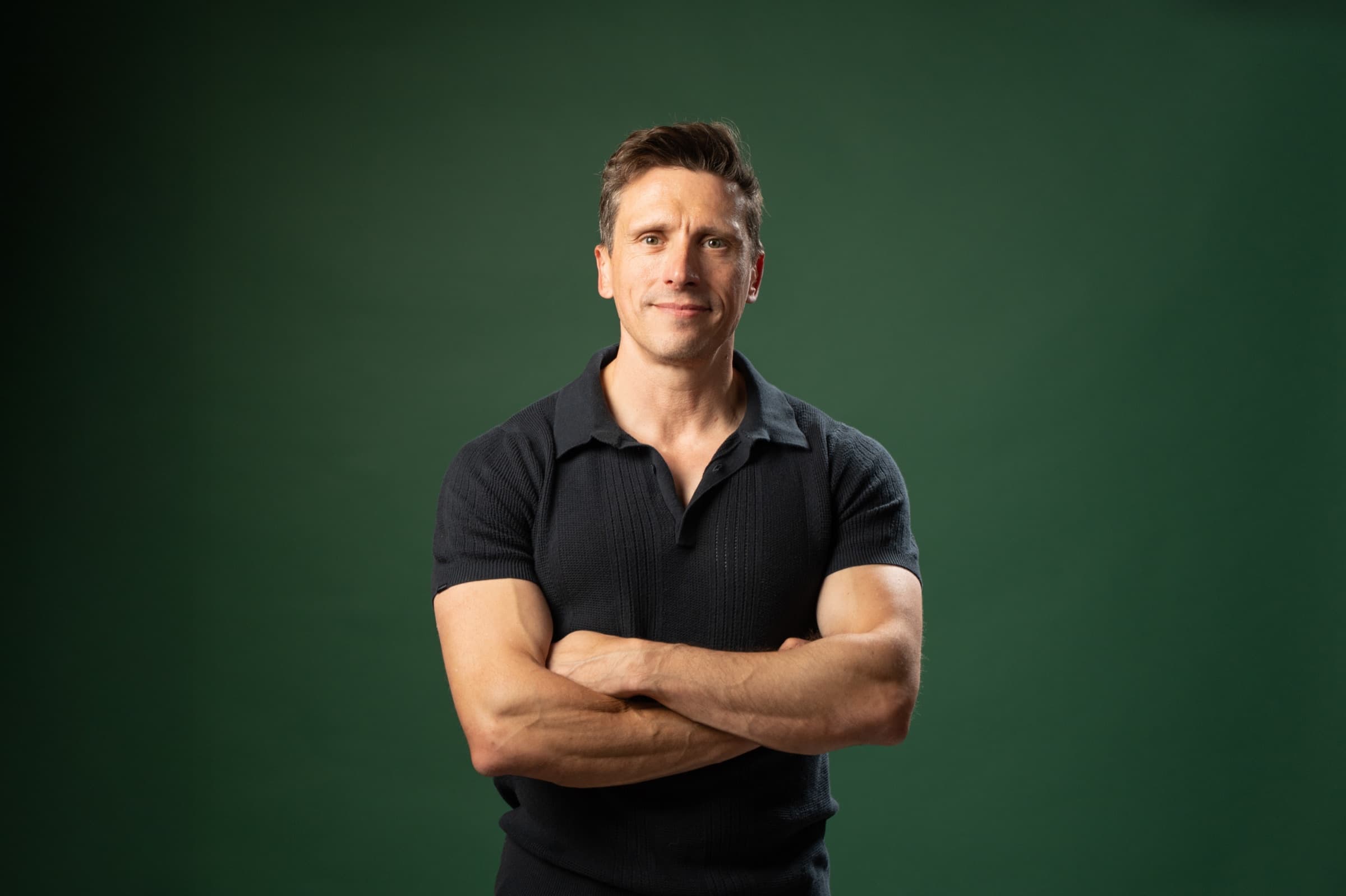 Dr Jeff Foster, photographed against a dark green background